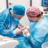 Doctors performing surgery on patient